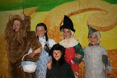 A group of children dressed up in costumes.
