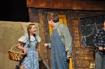 A young girl and boy in the wizard of oz.